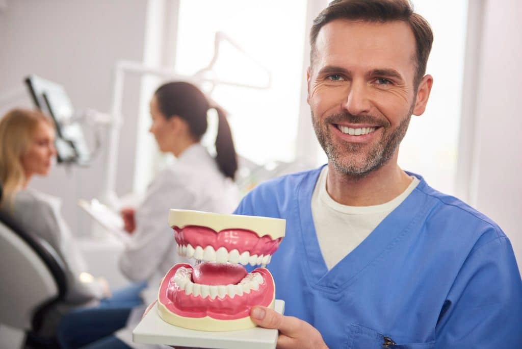 Artificial teeth and gums are used in dentures to replace missing or extracted natural teeth.
