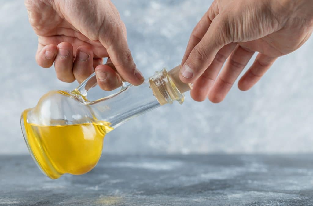 Oil pulling, also known as oil swishing, involves vigorously swishing oil in the mouth to accomplish its effects, much as how mouthwash and oral rinses are used today.