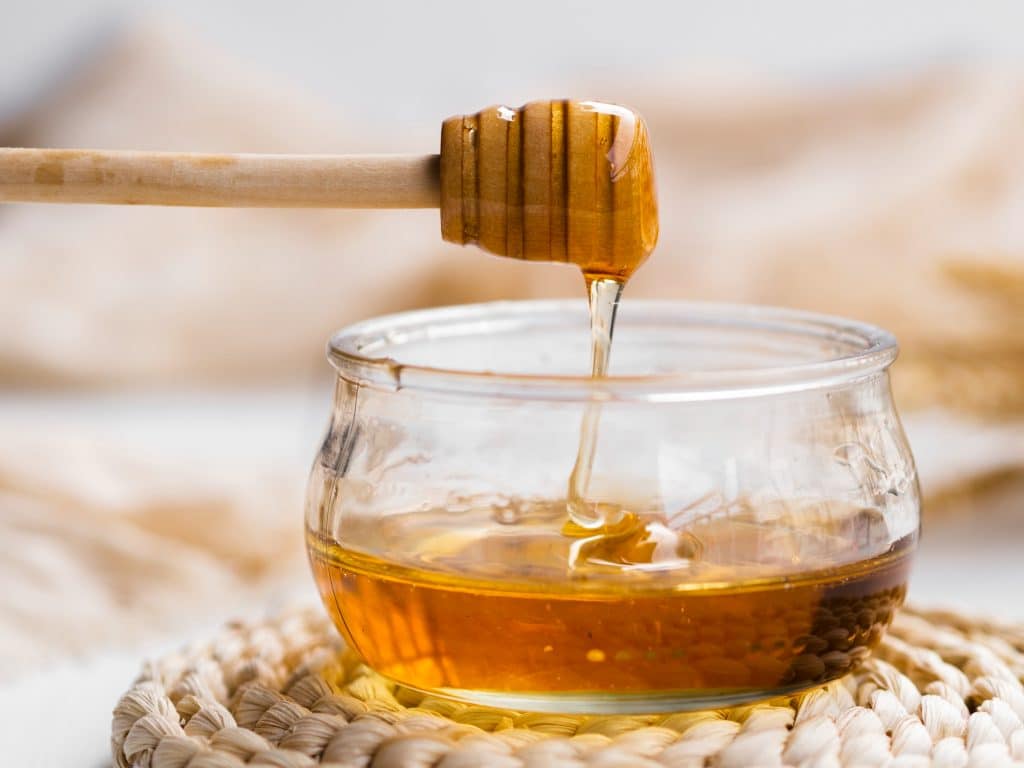 Bees produce Honey, a naturally sweet material, from the nectar of flowers. It is mostly composed of carbohydrates, with minute quantities of additional vitamins and minerals.
