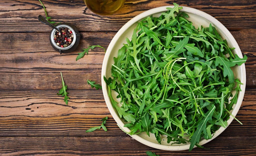 Arugula is a leafy green vegetable commonly referred to as rocket or roquette.  Along with kale, cauliflower, Brussels sprouts, and broccoli, they are cruciferous vegetables.
