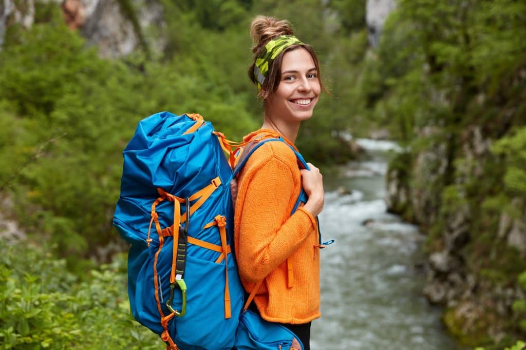 Hiking is an outdoor sport that entails walking or hiking along unpaved paths in beautiful, natural settings, such as mountains, forests, deserts, or coastal areas.