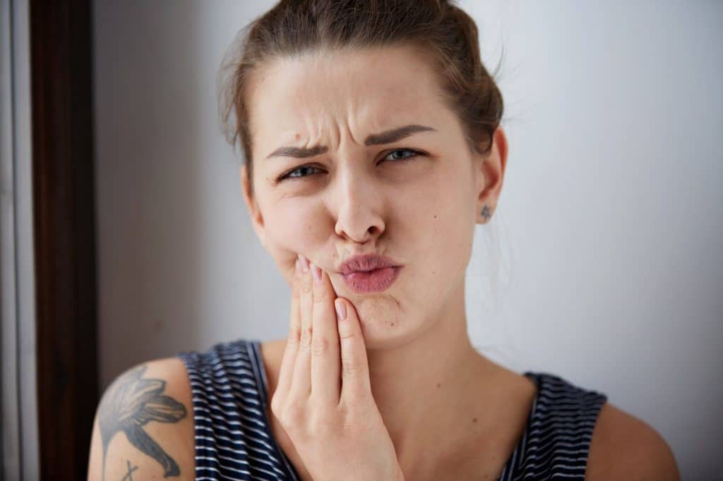 Mouth lesions are painful swellings in the oral soft tissues such as the lip, tongue, gum, cheeks, and floor or roof of the mouth.