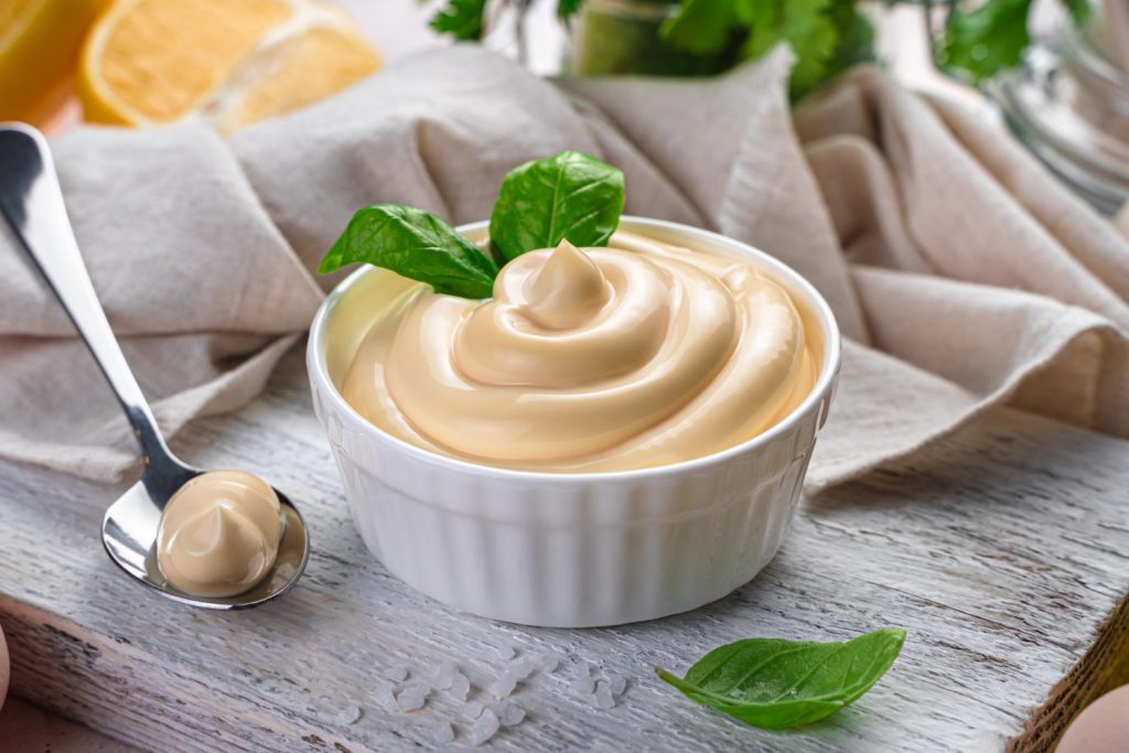 Mayo (mayonnaise) is a favorite seasoning for most people worldwide. It is popular in sandwiches, salads, and pasta due to its white color, thick, creamy texture, and sharp taste. 